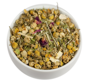 A bowl of Loose Leaf Lemon Drop Herbal Tea with dried chamomile, lemongrass, and other herbs from The Spice Hut.
